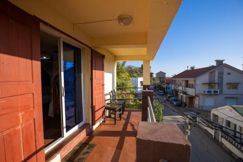 a balcony of a building with a bench on it at Studio Standard - AMI APPARTHOTEL in Tôlagnaro
