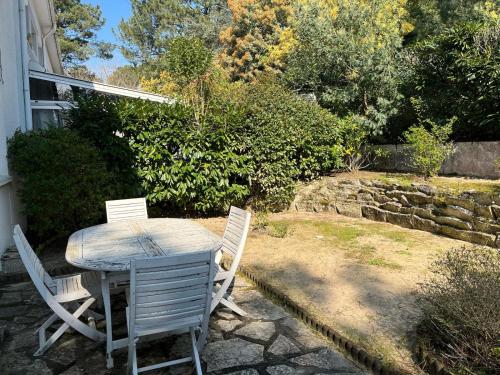 a table and chairs sitting on a patio at Galaxie in Arcachon