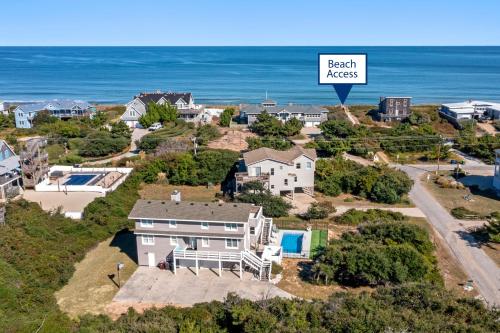 an aerial view of a house with the ocean in the background at Serenity Shores in Southern Shores