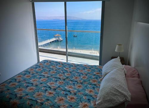 Postel nebo postele na pokoji v ubytování 1 Fila Vista Bahía Paracas - La Velas 501 T1