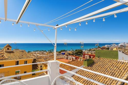 a view of the ocean from the balcony of a building at Modern loft with ocean views in Villajoyosa