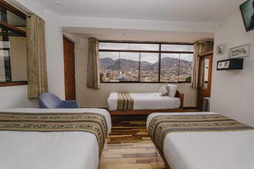 Postel nebo postele na pokoji v ubytování Cozy Room Cusco