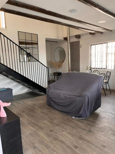 a large room with a bed in the middle at Casa en Pichilemu acogedora y amplia Casa Lile in Pichilemu