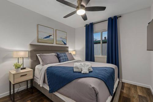 a bedroom with a bed and a ceiling fan at Splash In Your Private Free Heated Pool! in Glendale