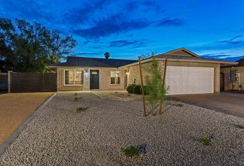 a house with a driveway and a garage at Splash In Your Private Free Heated Pool! in Glendale