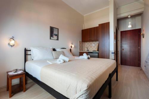 a bedroom with a large bed in a room at Mpalkoni Sti Monemvasia in Monemvasia