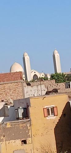 an old building with two domes on top of it at Habob Nubian Guest House in Aswan