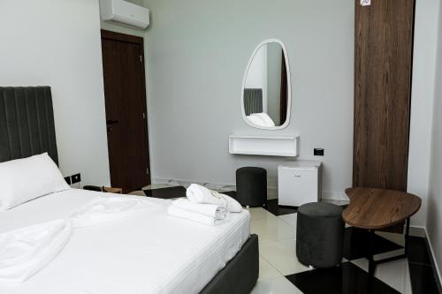 Postel nebo postele na pokoji v ubytování OLI Hotel