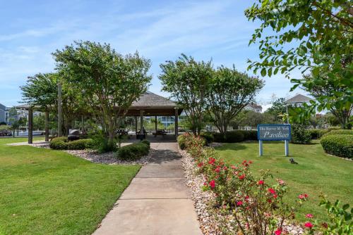a sign in a park with a gazebo at Skippers Landing in Manteo