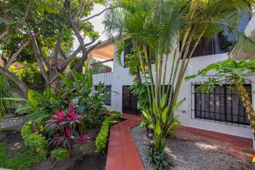 a house with trees and plants in front of it at NEW Bamboo Villa Palma Pool and Rest in Chiconcuac