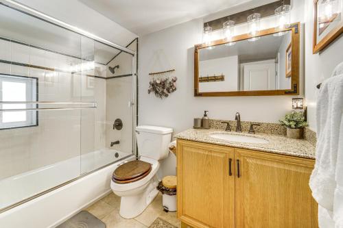 a bathroom with a toilet and a shower and a sink at Walk to Diamond Peak Luxe Chalet with Mtn-View Deck in Incline Village