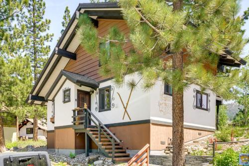 a house with a tree in front of it at Walk to Diamond Peak Luxe Chalet with Mtn-View Deck in Incline Village
