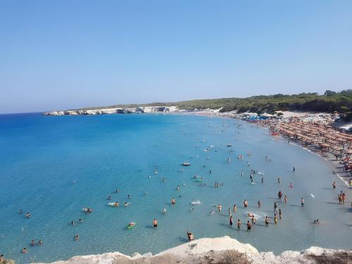 a group of people in the water at a beach at Nel Cuore Del Salento Dimora Tipica in Calimera