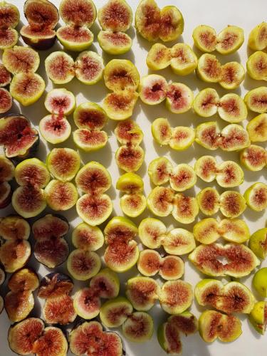 a bunch of cut up figs on a table at Nel Cuore Del Salento Dimora Tipica in Calimera