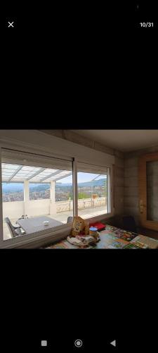 a view of a room with a large window at El Mirador"Venerable Escuder" in Cocentaina