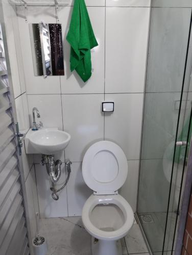 a small bathroom with a toilet and a sink at Hostel da Ladeira in Ouro Preto