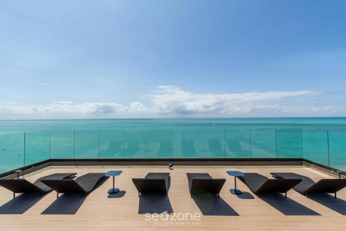 a view of the ocean from the roof of a building at NWTs - Estúdios com Vista Lateral Mar em Maceió IV in Maceió