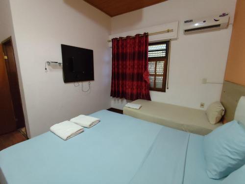 Camera con 2 Letti, TV e finestra di CEDE Inn Hotel a Encarnación