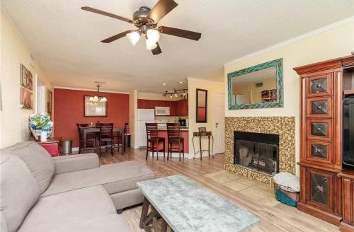 a living room with a couch and a fireplace at Jacks Spot MIBC 116 in Mustang Beach