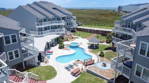 an aerial view of an apartment complex with a pool at Jacks Spot MIBC 116 in Mustang Beach