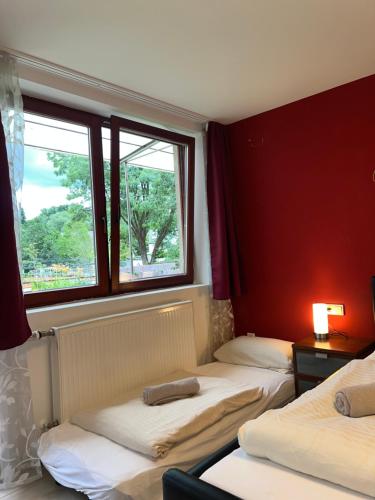 Postel nebo postele na pokoji v ubytování Hotel Scheunenwerk - Nürnberg Nord