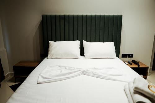 Postel nebo postele na pokoji v ubytování OLI Hotel