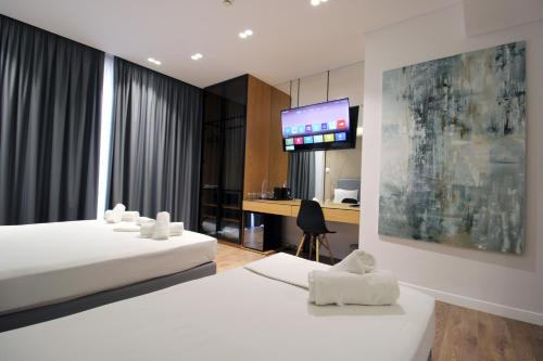 Postel nebo postele na pokoji v ubytování Valmar Hotel