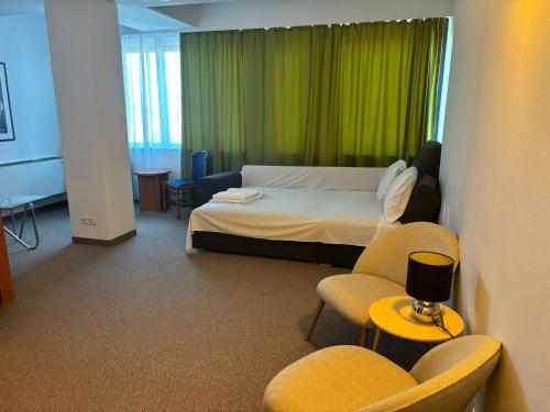 Postel nebo postele na pokoji v ubytování Excelsior Hotel Timisoara