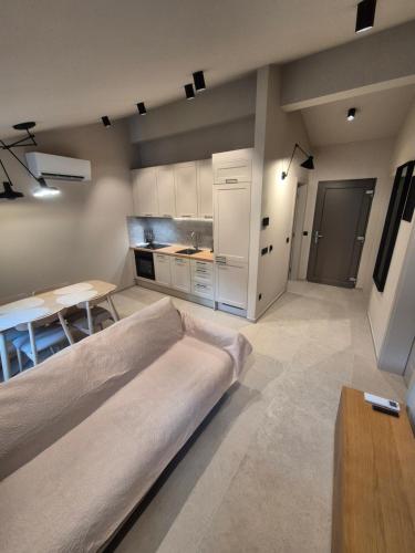 a living room with a couch and a table at Old Town Vrsar Premium Apartments in Vrsar