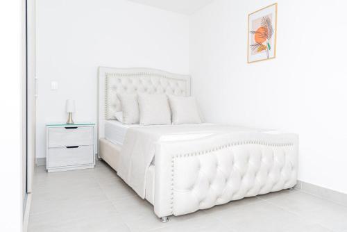 Voodi või voodid majutusasutuse Luxury air conditioning in Calazans toas