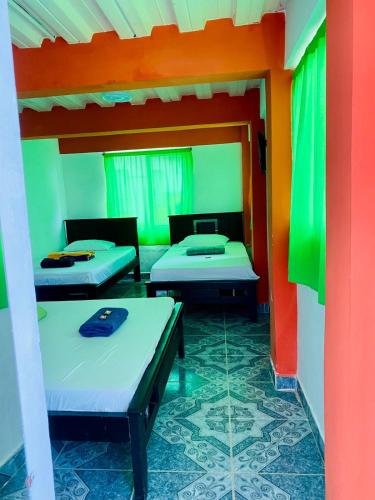 Katil atau katil-katil dalam bilik di Paisaje Cafetero Hotel Con Piscina y desayuno - Filandia