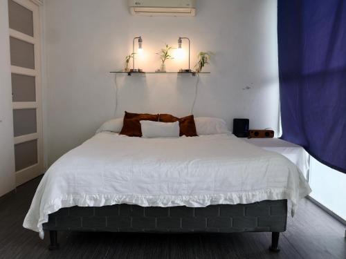 Una cama o camas en una habitación de Amá