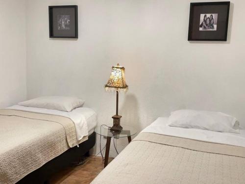 Ένα ή περισσότερα κρεβάτια σε δωμάτιο στο Casa 131, Casa familiar, Alojamiento completo