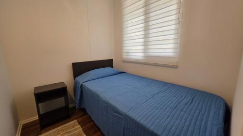 Ένα ή περισσότερα κρεβάτια σε δωμάτιο στο Oceana Suites Alto Panoramico Villarica
