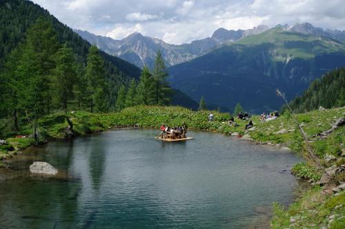 a group of people in a boat on a river at Familienwanderhof Eggeler in Liesing
