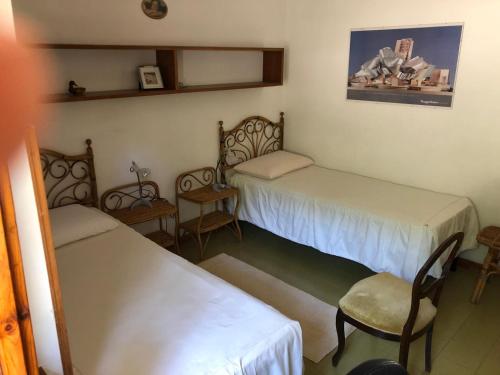 Ένα ή περισσότερα κρεβάτια σε δωμάτιο στο Villa Carra