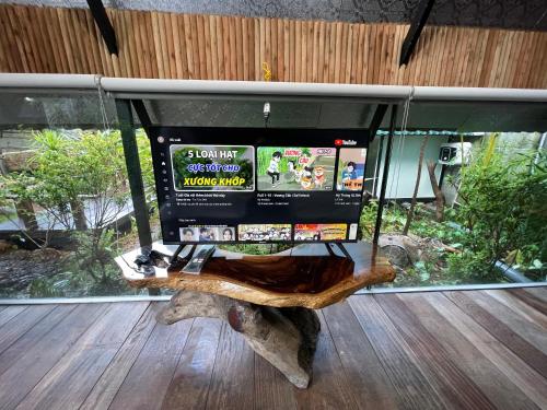 a bench in front of a window with screens at Bungalow HTC tuần châu in Ha Long