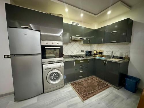 Kuchyň nebo kuchyňský kout v ubytování Appartement spacieux avec parking