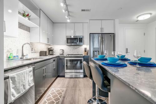a kitchen with a counter with blue dishes on it at Fully Furnished Apartment in Washington near Logan Circle in Washington