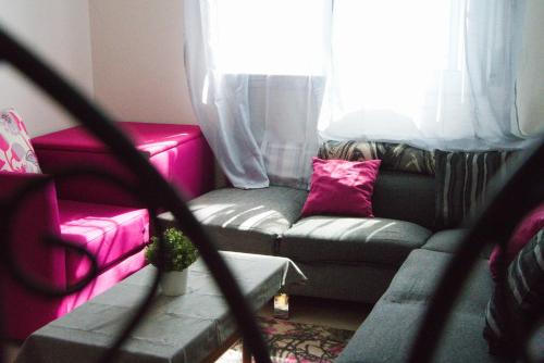 a living room with a couch and a window at Charming apartment in marvelous Martil with swimming pool in Martil