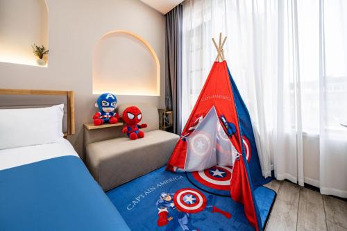 Katil atau katil-katil dalam bilik di Chuxin Moshe Hotel--Free shuttle bus service from PuD'ong Airport and Disneyland is available