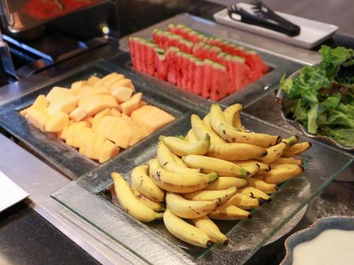 a bunch of bananas and other fruits and vegetables at DARA Hotel - SHA Plus in Phuket Town