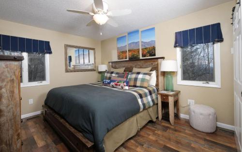 a bedroom with a bed and a ceiling fan at Majestic Getaway 1427 in Gatlinburg