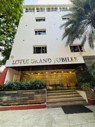 a building with a sign that reads holistic and justice at Hotel Lotus Grand Jubilee in Hyderabad
