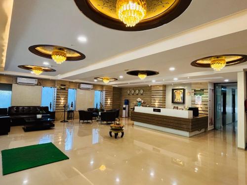 a lobby of a hotel with a reception desk at Hotel Lotus Grand Jubilee in Hyderabad