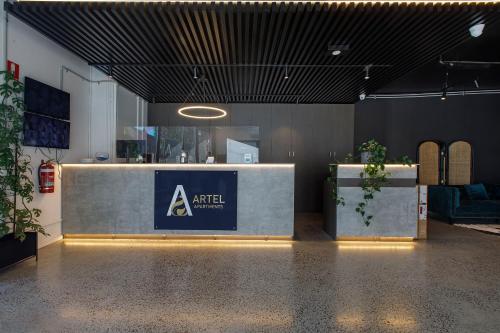 a room with a counter with a sign on it at Artel Apartments Brunswick in Melbourne