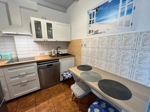 Una cocina o cocineta en A&R Brzozowa 5
