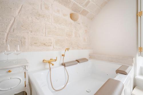 a bathroom with a shower and a toilet and a sink at Luxury Palazzo Principessa - Elegance and History in Center in Monopoli