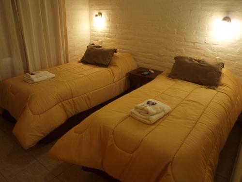 Postel nebo postele na pokoji v ubytování Apart C&C Valle Fértil