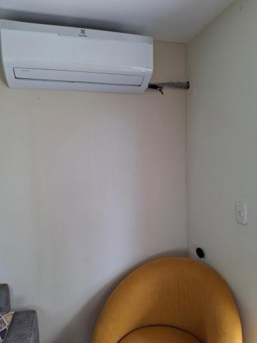 a bathroom with a ceiling fan and a toilet at Tonsupa Beach in Tonsupa
